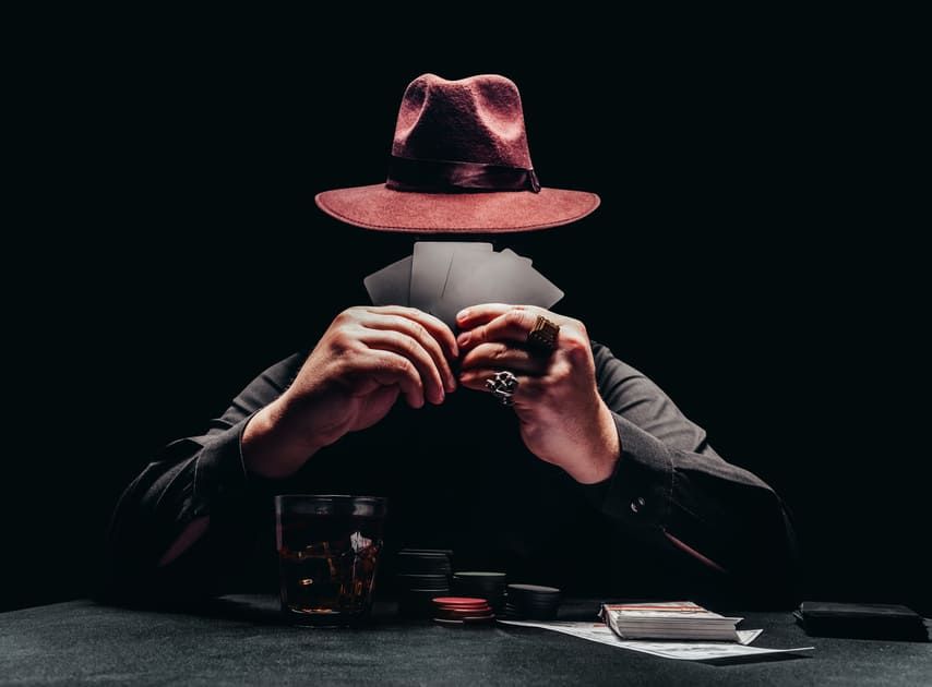 Faceless Man With Fedora and Cards